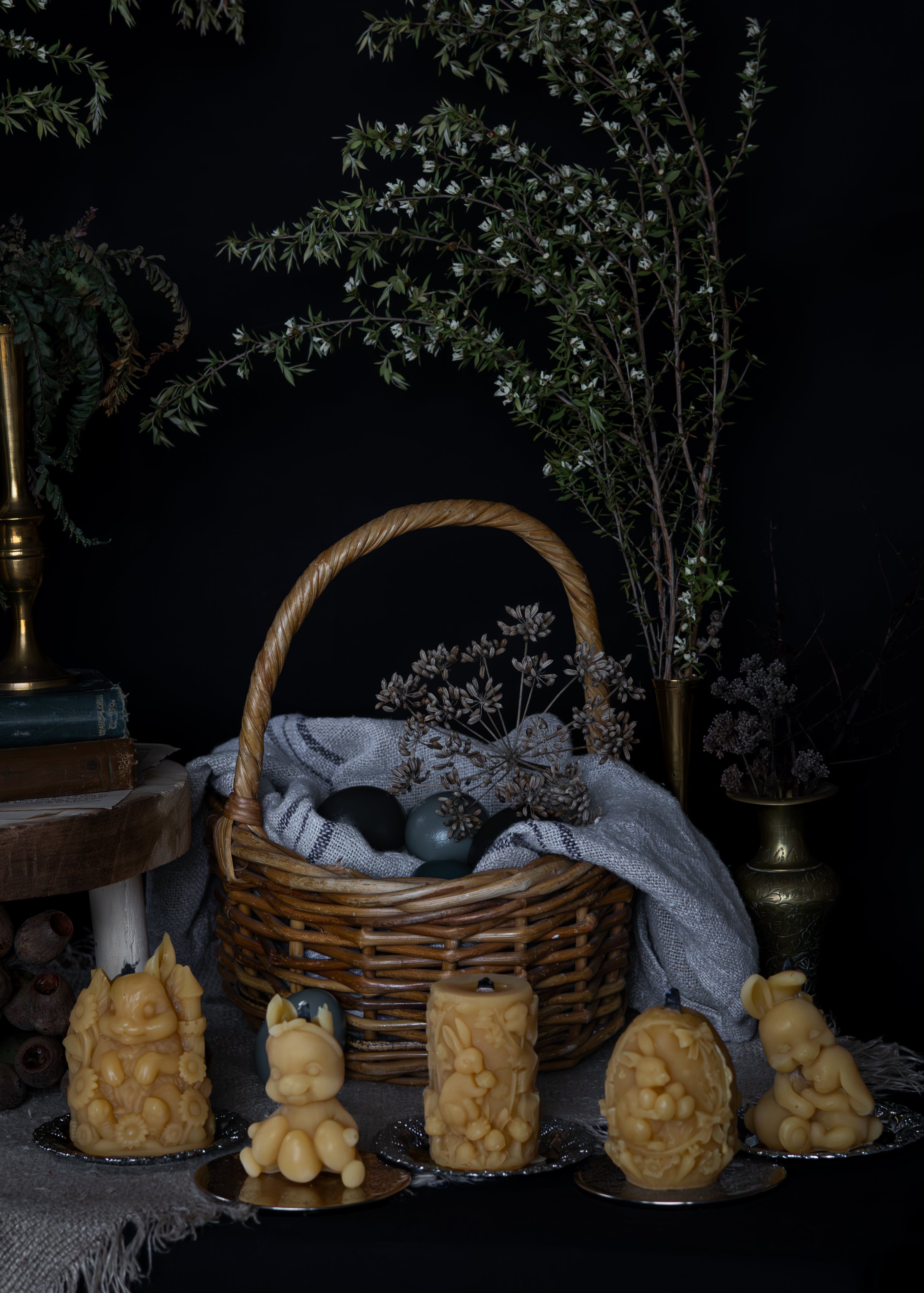 Wicker basket with decorative items on a dark background