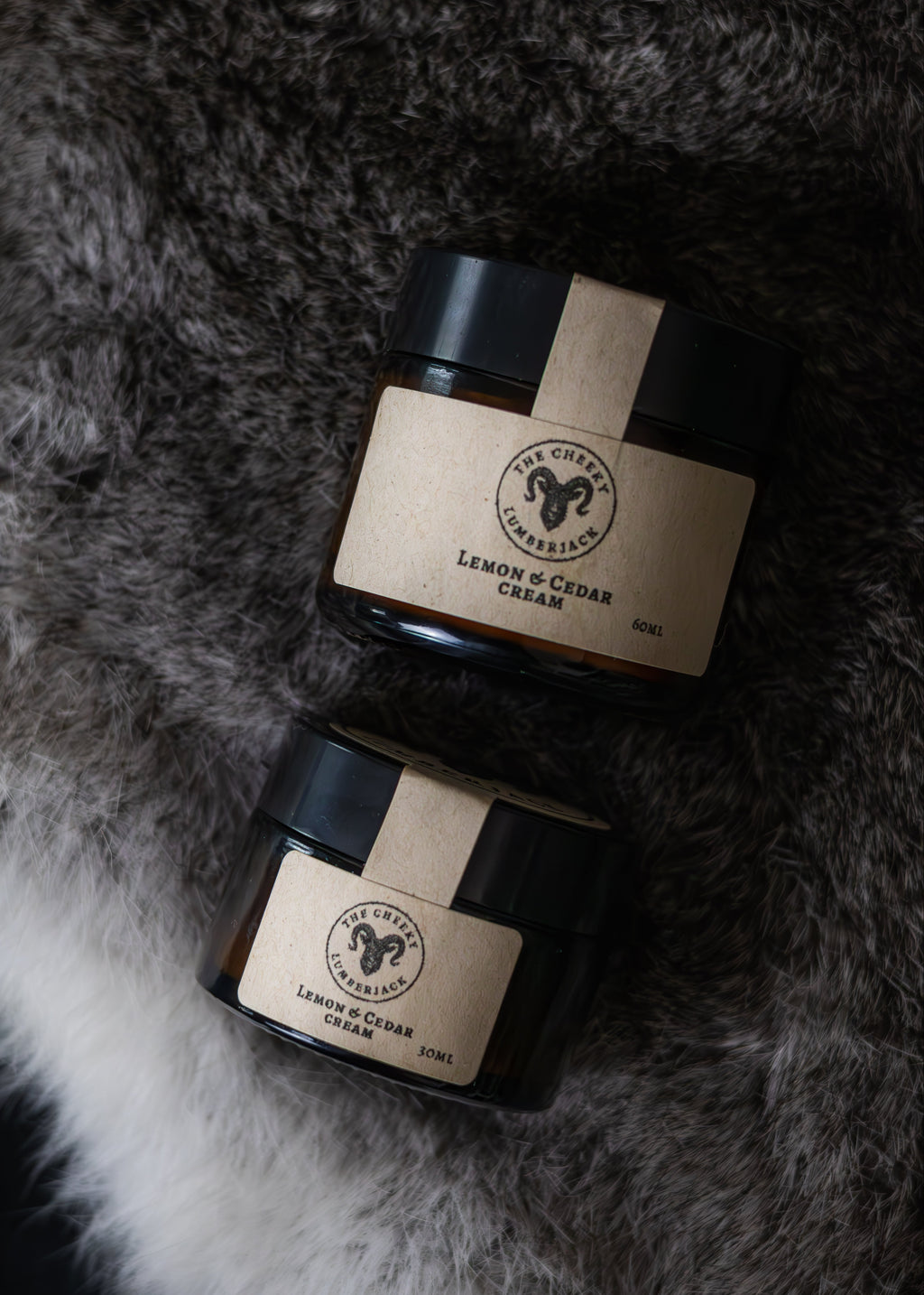 Two jars of Lemon Ceder Cream on a fur surface