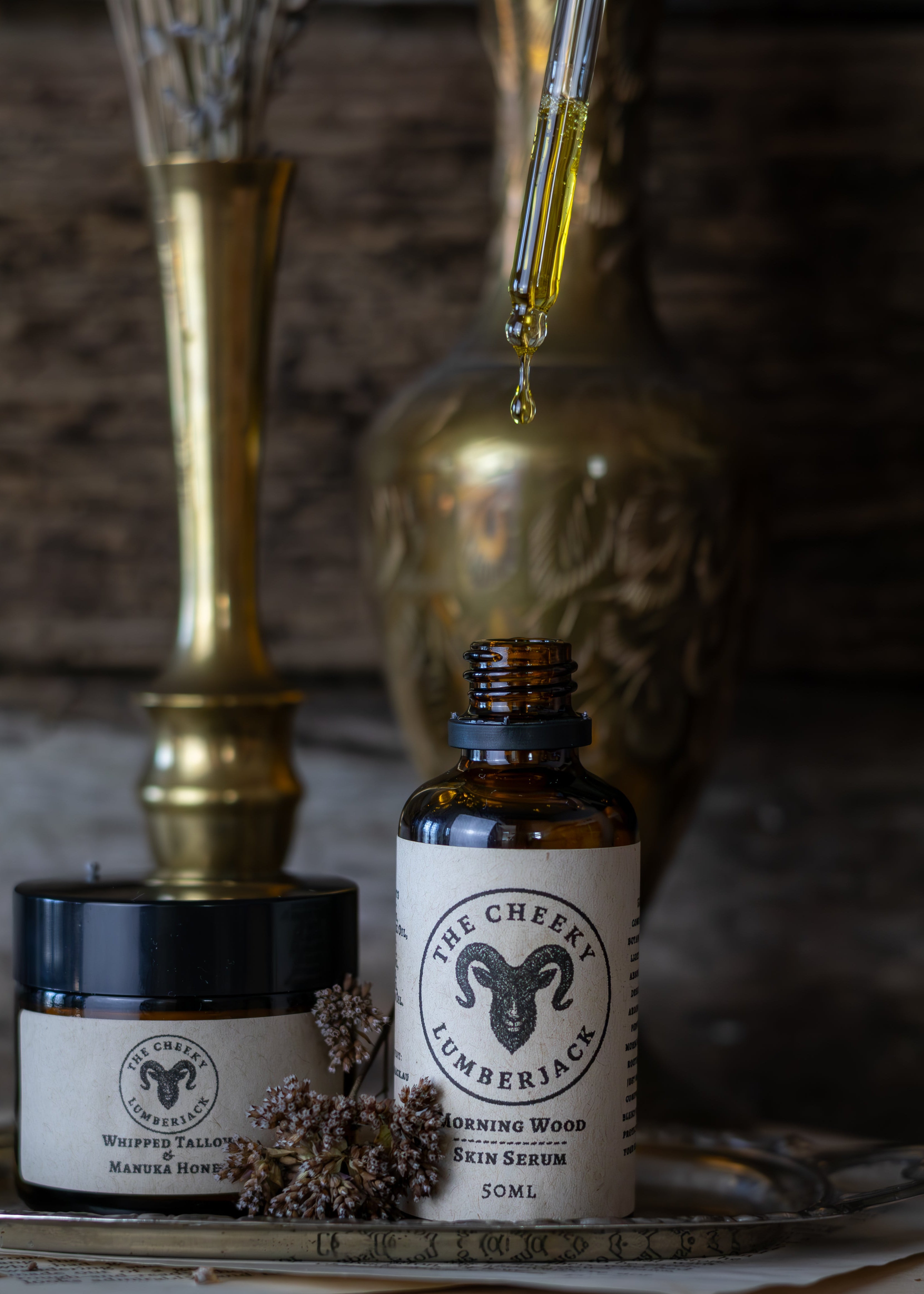 Skincare products with 'The Cheeky Lumberjack' branding on a rustic background